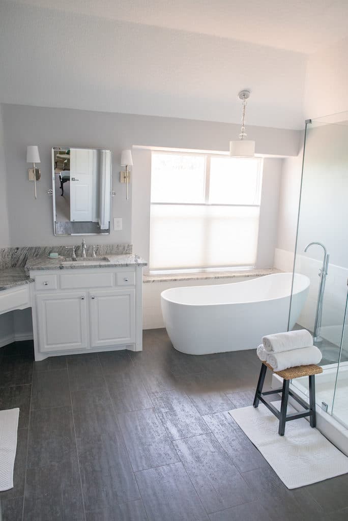 Master bath with freestanding tub and custom shower