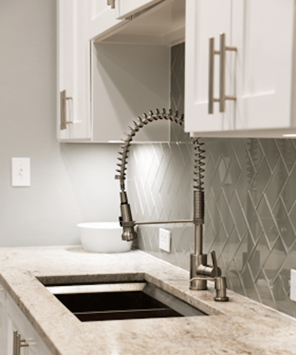 White kitchen, glass tiles sink