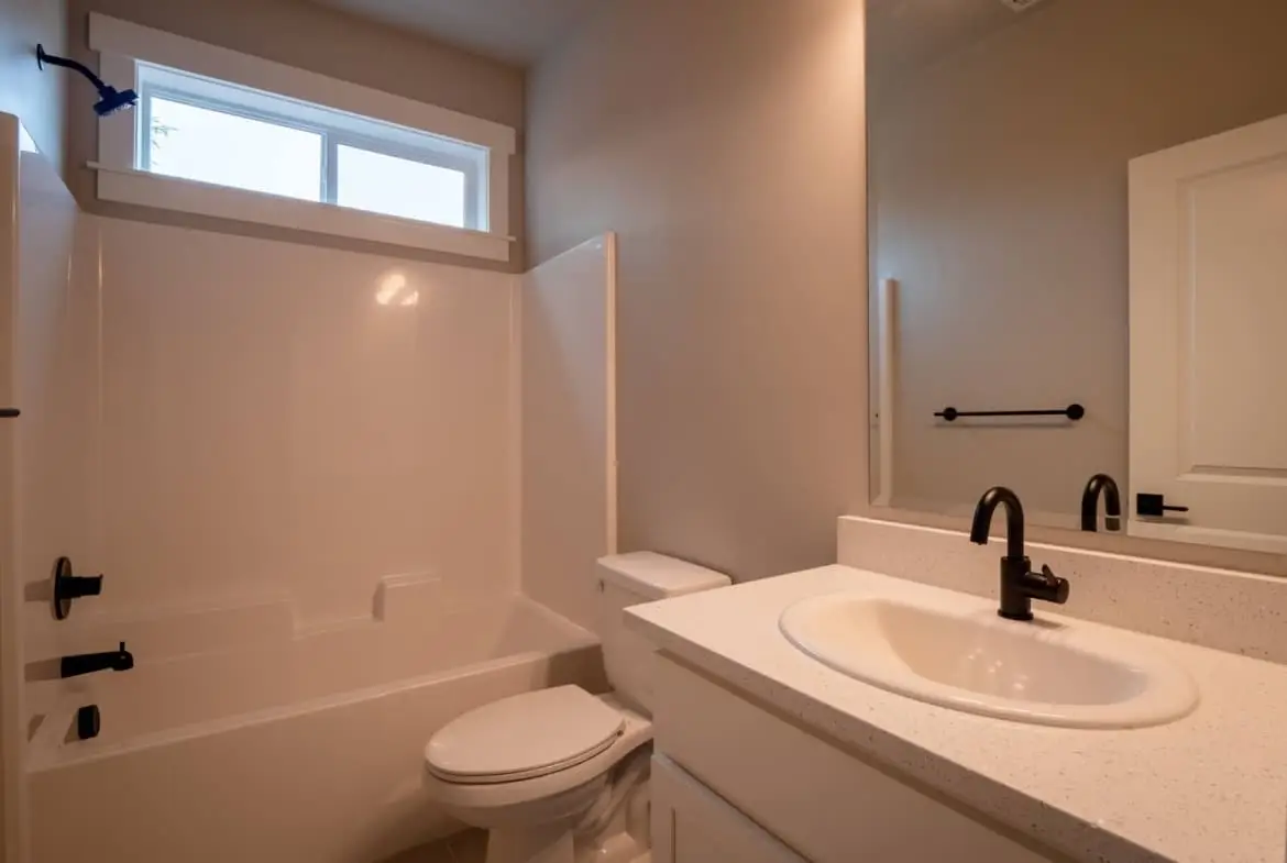 bathroom with a shower with a tub