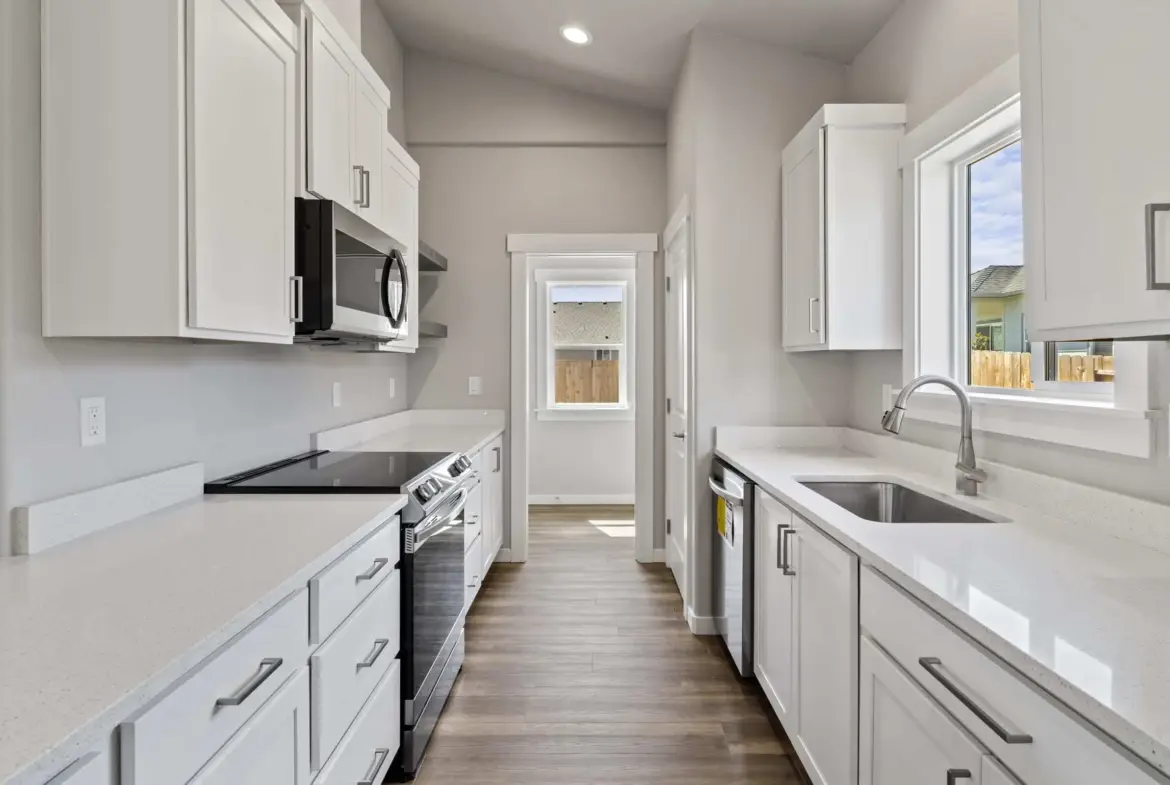 A Stunning White Kitchen with Stainless Steel Appliances