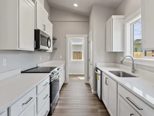 A Stunning White Kitchen with Stainless Steel Appliances"