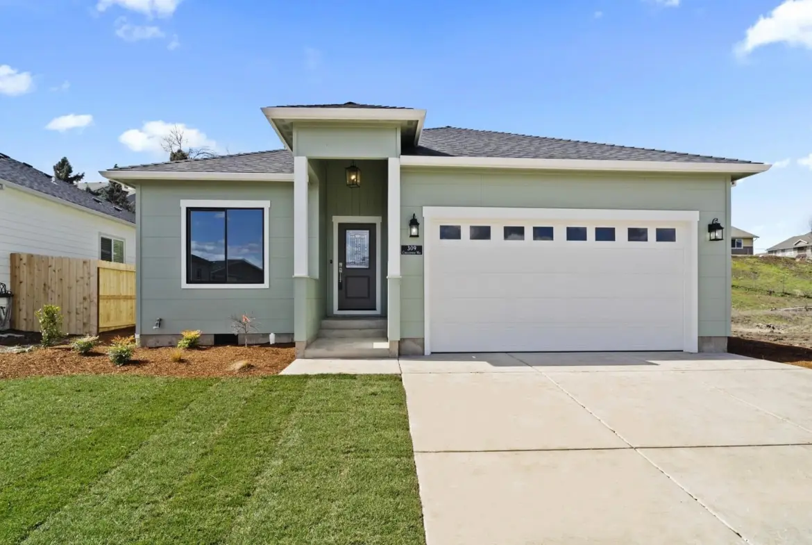 green house with a white garage