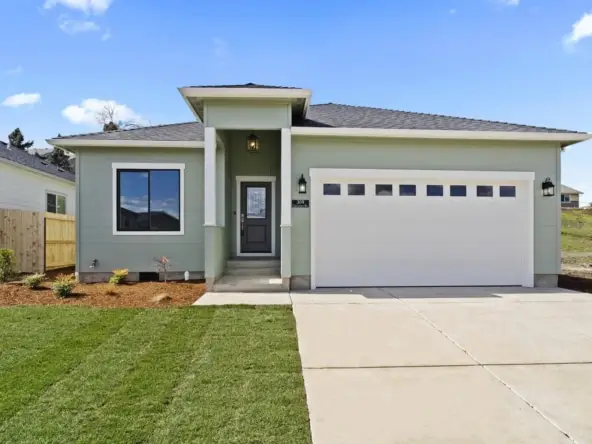 green house with a white garage