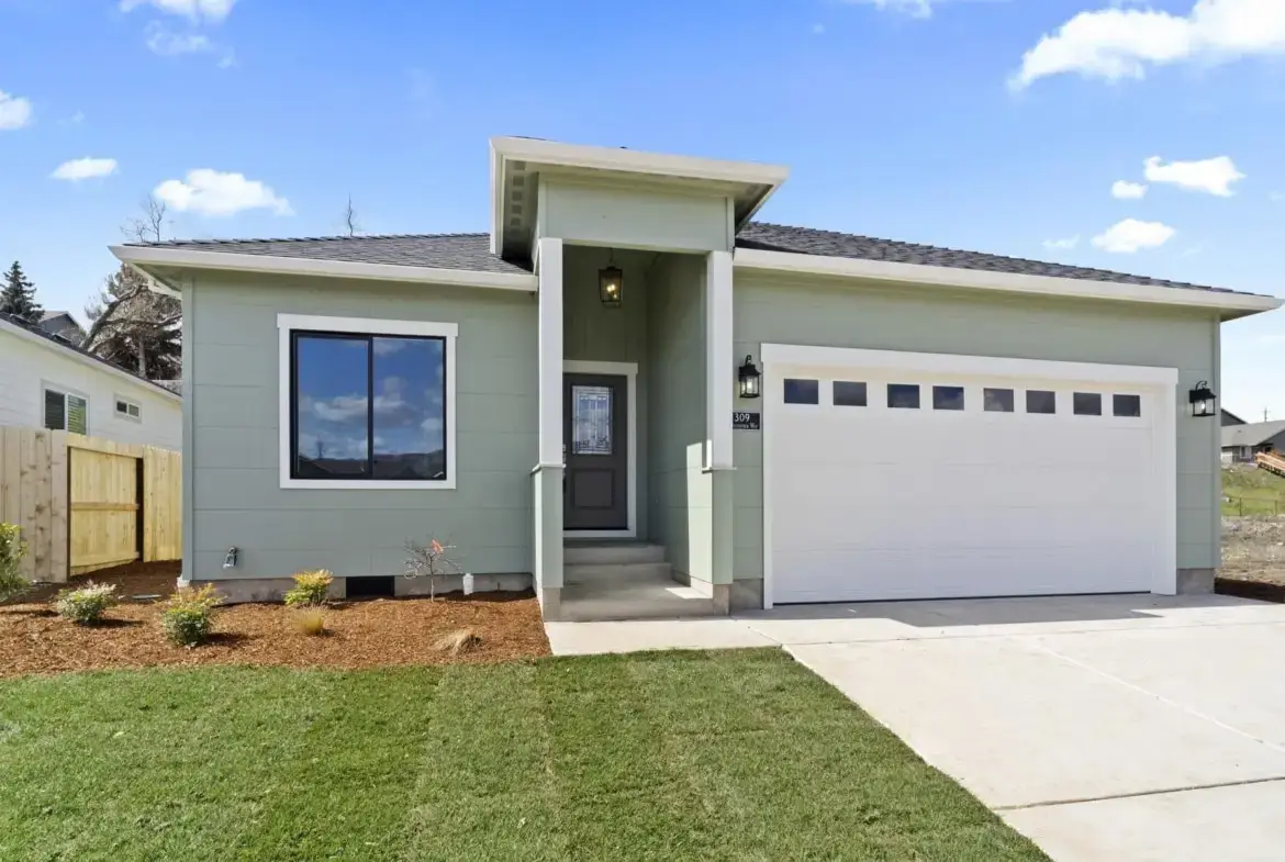 green house with a white garage