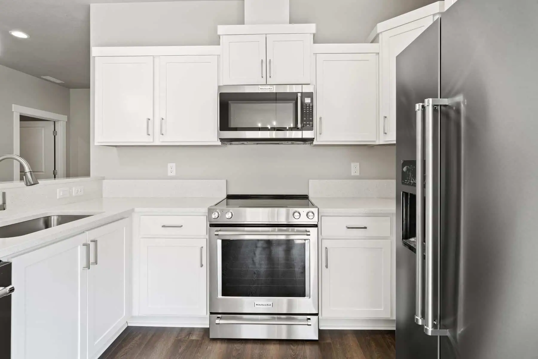 a kitchen with white counters