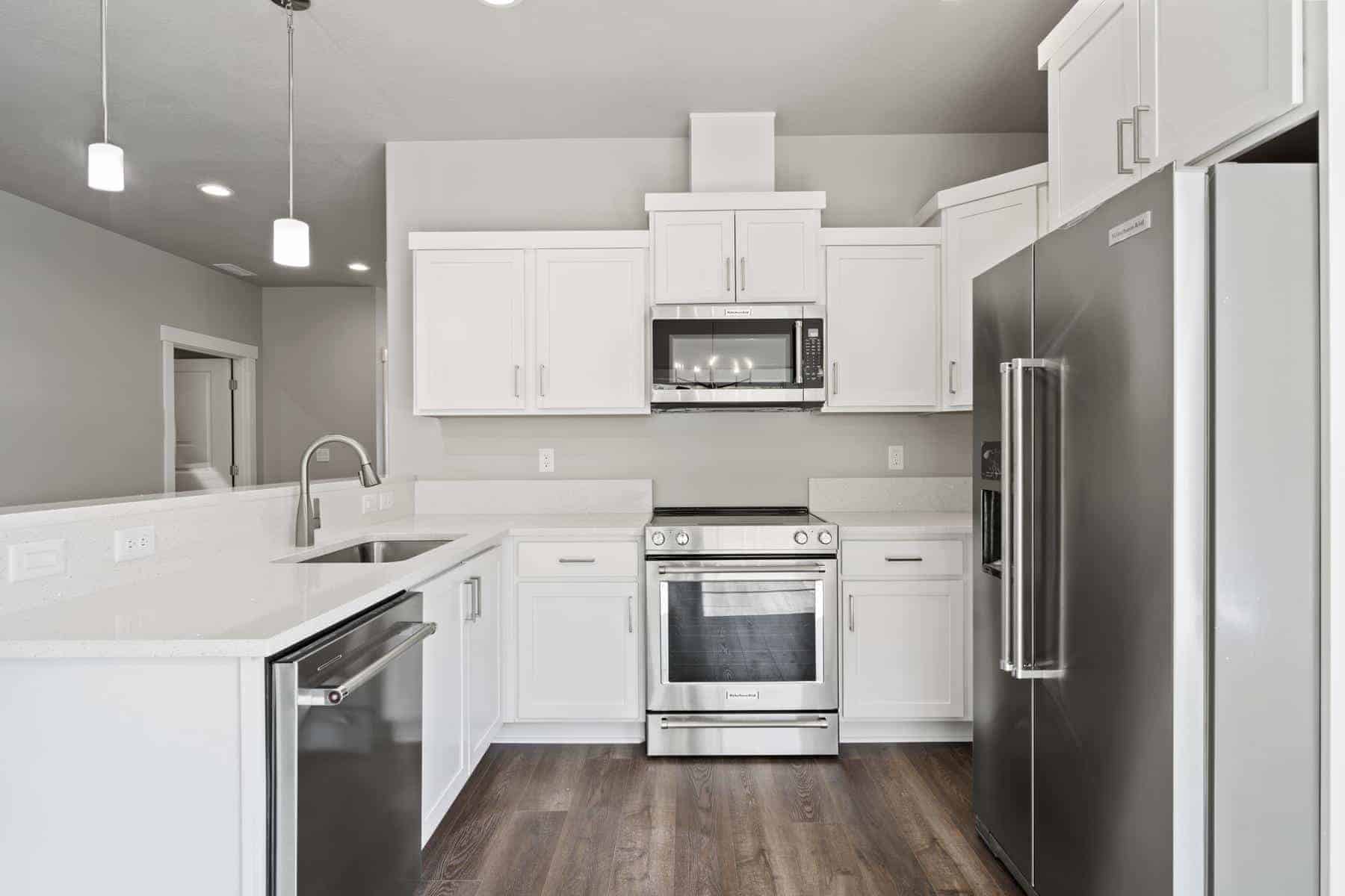 a kitchen with white counters