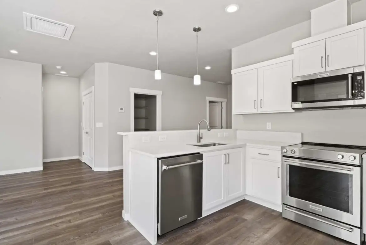 a kitchen with white counters