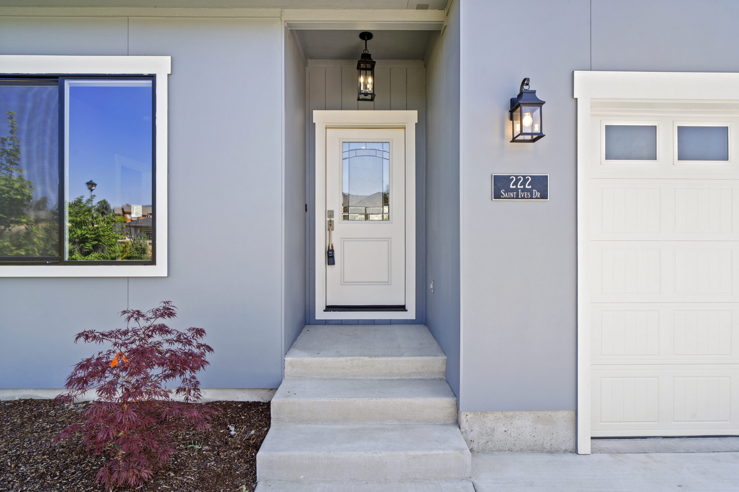 An inviting blue house with a charming white door,